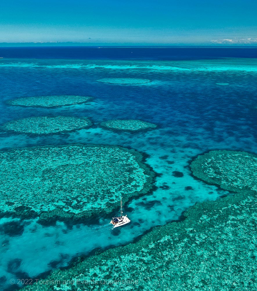 Aerial photograph of sailing through the Great Barrier Reef – Australia - © Tourism and Events Queensland