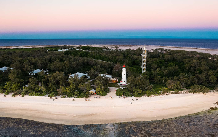 Sandy island with lighthouse on the Great Barrier Reef