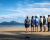 Six people standing on the beach looking out into the horizon. (C): Commonwealth of Australia: Reef Authority