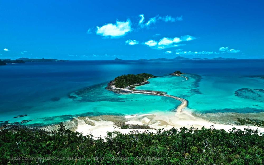    Aerial photograph of the Great Barrier Reef from an island – © Commonwealth of Australia – (Reef Authority) - Photographer: Johnny Gaskell