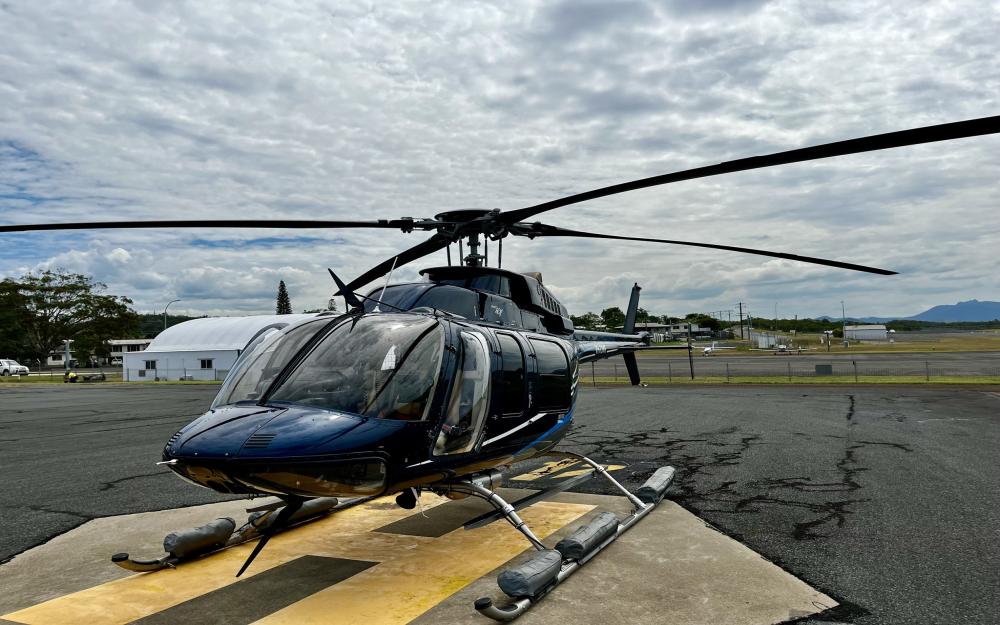 Helicopter conducting aerial surveys to assess coral bleaching extent