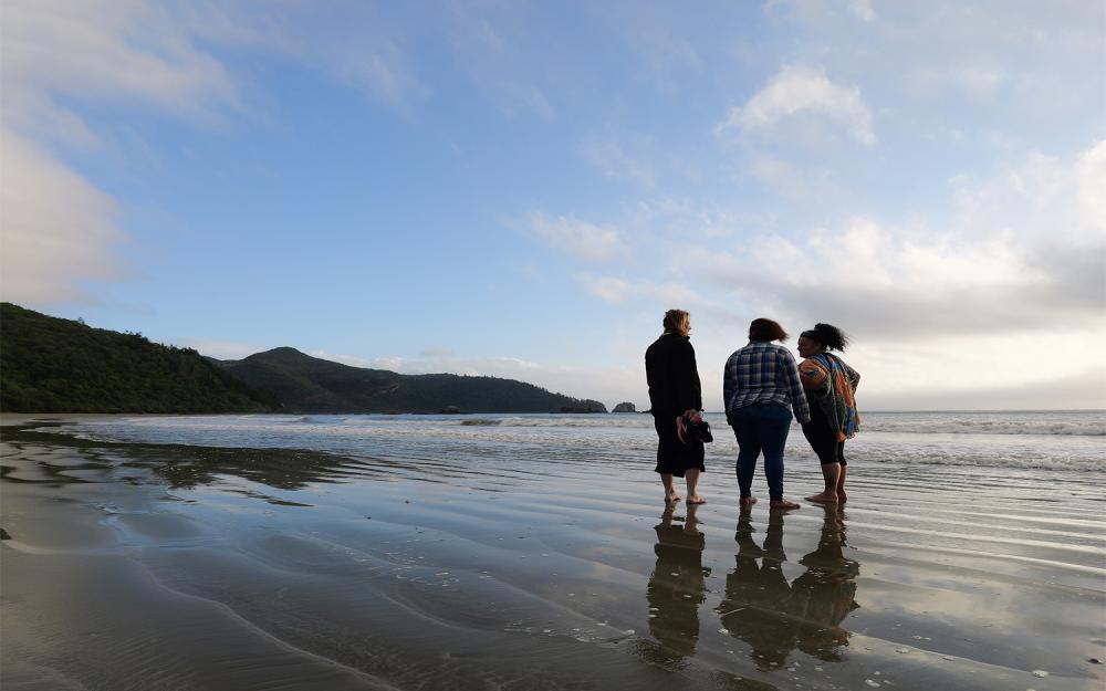 Traditional Owners on beach in Mackay