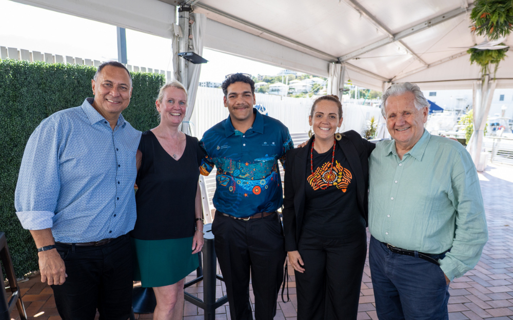 Five people including board members and Indigenous Reef Advisory Committee members pose for a photo.