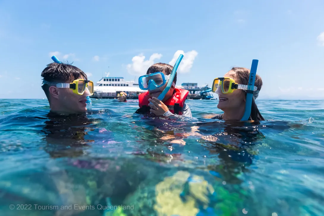 Family snorkeling in the Great Barrier Reef Marine Park  – Australia - © Tourism and Events Queensland